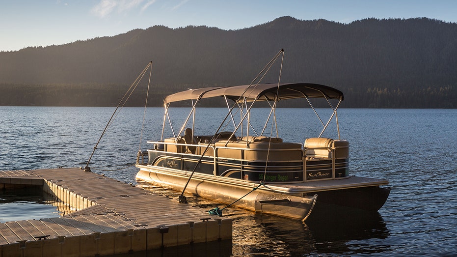 A pontoon boat in the water