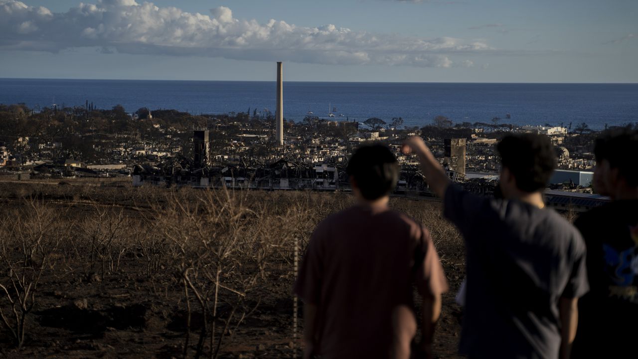 People looking down to downtown Lahaina from Lahaina Bypass in Lahaina, Hawaii on August 13, 2023.